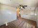 Open living area with carpet, ceiling fan, and view of the upper level at 7748 Catalina Harbor St, Las Vegas, NV 89131