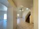 Bright living room featuring tile floors and staircase at 7748 Catalina Harbor St, Las Vegas, NV 89131