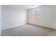 Neutral bedroom showcasing a carpeted floor and a window with a view at 785 Black Palace St, Henderson, NV 89011