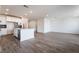 Bright kitchen features white cabinets, a center island, and stainless steel appliances at 785 Black Palace St, Henderson, NV 89011
