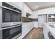 A kitchen with white cabinets and stainless steel appliances including an oven at 785 Black Palace St, Henderson, NV 89011