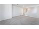 Second-floor loft with neutral carpet, a view of staircase, and white banisters at 785 Black Palace St, Henderson, NV 89011