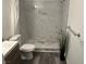 Bathroom featuring a marble shower with new fixtures, gray flooring, and modern vanity at 7885 W Flamingo Rd # 2019, Las Vegas, NV 89147