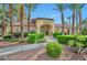 Exterior view of the community clubhouse with lush landscaping and a well-maintained entrance at 7885 W Flamingo Rd # 2019, Las Vegas, NV 89147