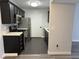 Updated kitchen with stainless steel appliances and dark cabinets at 7885 W Flamingo Rd # 2019, Las Vegas, NV 89147
