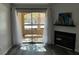 Inviting living room with sliding glass doors to a patio, fireplace, and neutral walls at 7885 W Flamingo Rd # 2019, Las Vegas, NV 89147