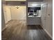 Open-concept living space with sleek hardwood flooring and natural light at 7885 W Flamingo Rd # 2019, Las Vegas, NV 89147