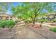 Serene walkway through the community, featuring lush landscaping and mature trees for a peaceful stroll at 7885 W Flamingo Rd # 2019, Las Vegas, NV 89147