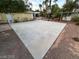 Backyard featuring a full concrete pad, basketball hoop and minimal landscaping at 8138 Yucca Springs Dr, Las Vegas, NV 89129