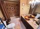 Bathroom with shower-tub combination, decorative tile backsplash, decorative vessel sink, and tiled flooring at 8138 Yucca Springs Dr, Las Vegas, NV 89129