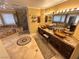 Luxurious bathroom featuring tiled flooring, glass enclosed shower, and double sinks with decorative bowl accents at 8138 Yucca Springs Dr, Las Vegas, NV 89129