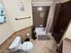 Cozy bathroom features a shower-tub combo, tiled walls and floors, along with fixtures such as a mounted towel bar at 8138 Yucca Springs Dr, Las Vegas, NV 89129