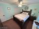 Well-lit bedroom with ceiling fan, large window, carpeted flooring and a spacious closet provides plenty of storage at 8138 Yucca Springs Dr, Las Vegas, NV 89129