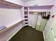 Bright walk-in closet with shelving and hanging rods, providing ample storage, drawers and clothing at 8138 Yucca Springs Dr, Las Vegas, NV 89129