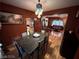 Chic dining area boasts a granite-topped table, unique lighting, and seamless flow into living spaces perfect for entertaining at 8138 Yucca Springs Dr, Las Vegas, NV 89129