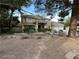 Charming home with a well-maintained front yard, mature trees, and a welcoming entrance creating a warm curb appeal at 8138 Yucca Springs Dr, Las Vegas, NV 89129