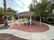 Outdoor living space with a shaded gazebo, ping pong table, and landscaped yard at 8138 Yucca Springs Dr, Las Vegas, NV 89129