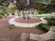 Landscaped backyard featuring a covered gazebo, ping pong table and putting green at 8138 Yucca Springs Dr, Las Vegas, NV 89129