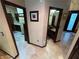 Inviting hallway showcasing tiled flooring and views of the kitchen and bathroom spaces in the home at 8138 Yucca Springs Dr, Las Vegas, NV 89129