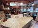 Spacious kitchen featuring granite countertops, stainless steel appliances, and a central island with sink at 8138 Yucca Springs Dr, Las Vegas, NV 89129