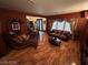 Comfortable living room showcasing hardwood floors, a plush chaise lounge, and a relaxed ambiance for everyday living at 8138 Yucca Springs Dr, Las Vegas, NV 89129