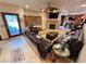 Cozy living room featuring a fireplace, tile floors and comfortable seating arrangements at 8138 Yucca Springs Dr, Las Vegas, NV 89129