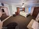 Spacious main bedroom featuring plush carpeting, a ceiling fan, and large window allowing for lots of natural light at 8138 Yucca Springs Dr, Las Vegas, NV 89129