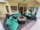 Inviting outdoor patio with an outdoor lounge area and a stone fireplace, surrounded by colorful plants and great views at 8138 Yucca Springs Dr, Las Vegas, NV 89129
