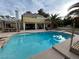 Stunning pool with attached hot tub and diving board with a view of the house at 8138 Yucca Springs Dr, Las Vegas, NV 89129