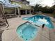 Backyard featuring a pool and hot tub with plenty of patio space, perfect for outdoor entertaining at 8138 Yucca Springs Dr, Las Vegas, NV 89129
