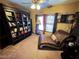 Cozy reading nook with a large bookcase and comfortable chaise lounge at 8138 Yucca Springs Dr, Las Vegas, NV 89129