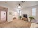 Spacious bonus room features neutral carpet, a ceiling fan, and leads into other rooms of the home at 8247 Oasis Bloom St, North Las Vegas, NV 89085