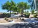Picturesque community with tree-lined walking paths, lush landscaping, and mailbox, perfect for enjoying the outdoors at 8247 Oasis Bloom St, North Las Vegas, NV 89085