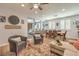 Inviting living room with wood-look floors, neutral decor, and access to other areas at 8247 Oasis Bloom St, North Las Vegas, NV 89085