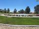 Gathering-friendly park featuring a basketball court, picnic area, and lush landscaping, perfect for community gatherings and recreation at 8247 Oasis Bloom St, North Las Vegas, NV 89085