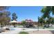 Gathering park featuring play structures with climbing areas and slides, perfect for recreation and outdoor fun at 8247 Oasis Bloom St, North Las Vegas, NV 89085
