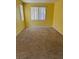 Spacious bedroom with plush carpeting and ample natural light, providing a serene atmosphere at 8325 Aspen Village St, Las Vegas, NV 89113