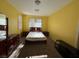 Simple bedroom featuring neutral carpet and walls and matching wood furniture and full-sized bed at 8325 Aspen Village St, Las Vegas, NV 89113