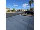 Street view with paved driveway and manicured front yard at 8325 Aspen Village St, Las Vegas, NV 89113