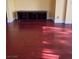 A spacious living room has wood flooring and a built-in shelving unit at 8325 Aspen Village St, Las Vegas, NV 89113