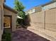 Serene backyard featuring a patio, mature tree, and privacy wall, perfect for outdoor enjoyment at 8345 Mozley Park St, Las Vegas, NV 89113