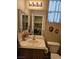 Bathroom featuring a single sink vanity, toilet, and window with natural light at 8345 Mozley Park St, Las Vegas, NV 89113