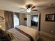 Bright and airy bedroom with calm ambiance, carpet, and natural light streaming in at 8345 Mozley Park St, Las Vegas, NV 89113