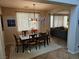 Dining room with large window offering plenty of natural light and a view of the living room at 8345 Mozley Park St, Las Vegas, NV 89113