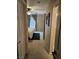 Hallway leading into a bedroom with natural light and a ceiling fan at 8345 Mozley Park St, Las Vegas, NV 89113