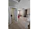 Upstairs hallway area offering extra living space with a red sofa and natural light at 8345 Mozley Park St, Las Vegas, NV 89113