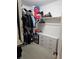 Well-organized walk-in closet with ample hanging space and built-in drawers for storage at 8345 Mozley Park St, Las Vegas, NV 89113