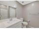 Bathroom featuring a vanity with a quartz countertop and a walk-in shower at 8562 Insignia Ave # 102, Las Vegas, NV 89178