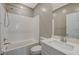 Bright bathroom features a shower and vanity with single sink at 8562 Insignia Ave # 102, Las Vegas, NV 89178
