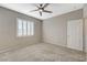 Bedroom featuring neutral walls, plush carpet and a ceiling fan at 8562 Insignia Ave # 102, Las Vegas, NV 89178